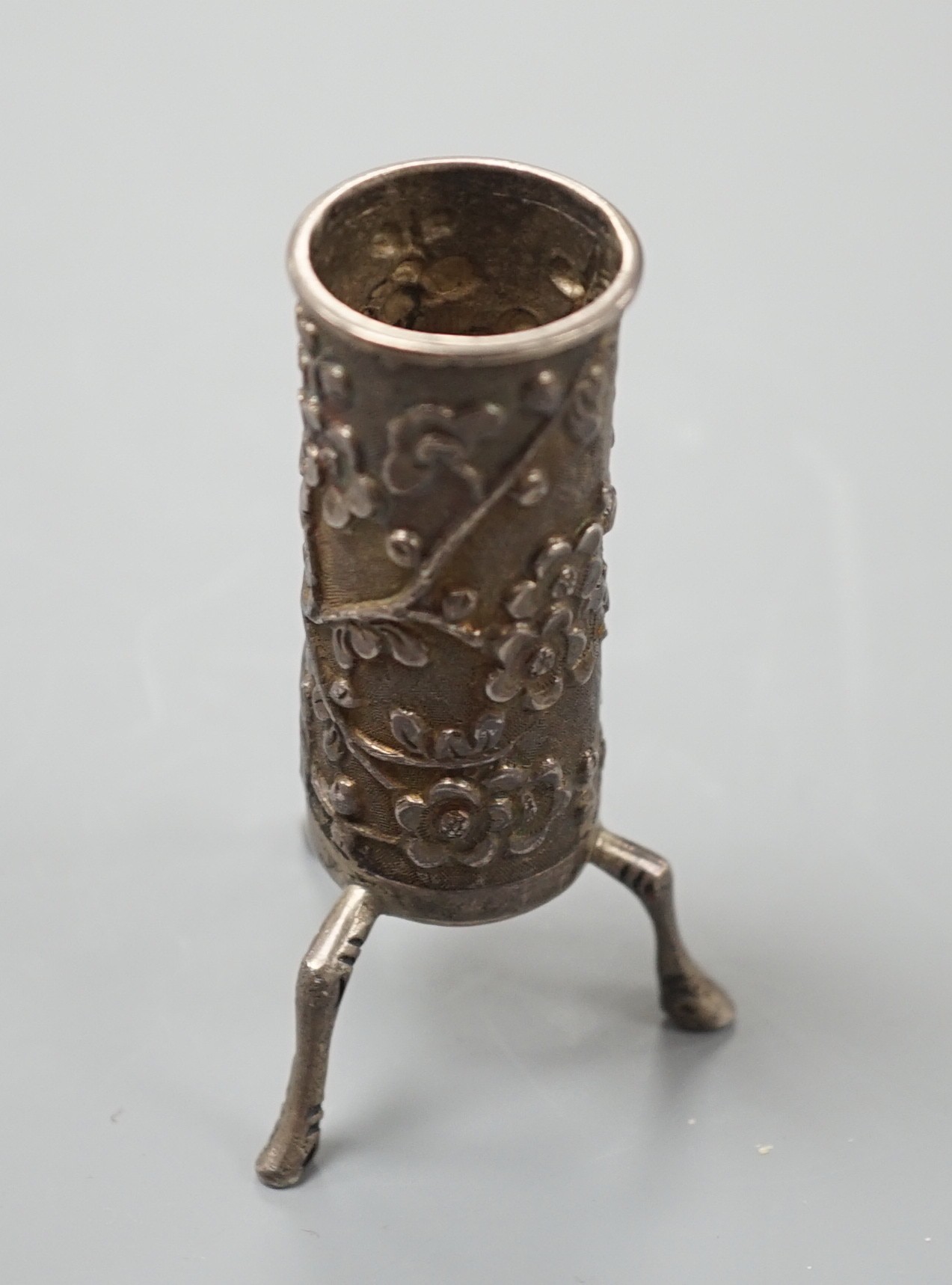 A Chinese silver sleeve vase, by Wang Hing, 7 cms high.